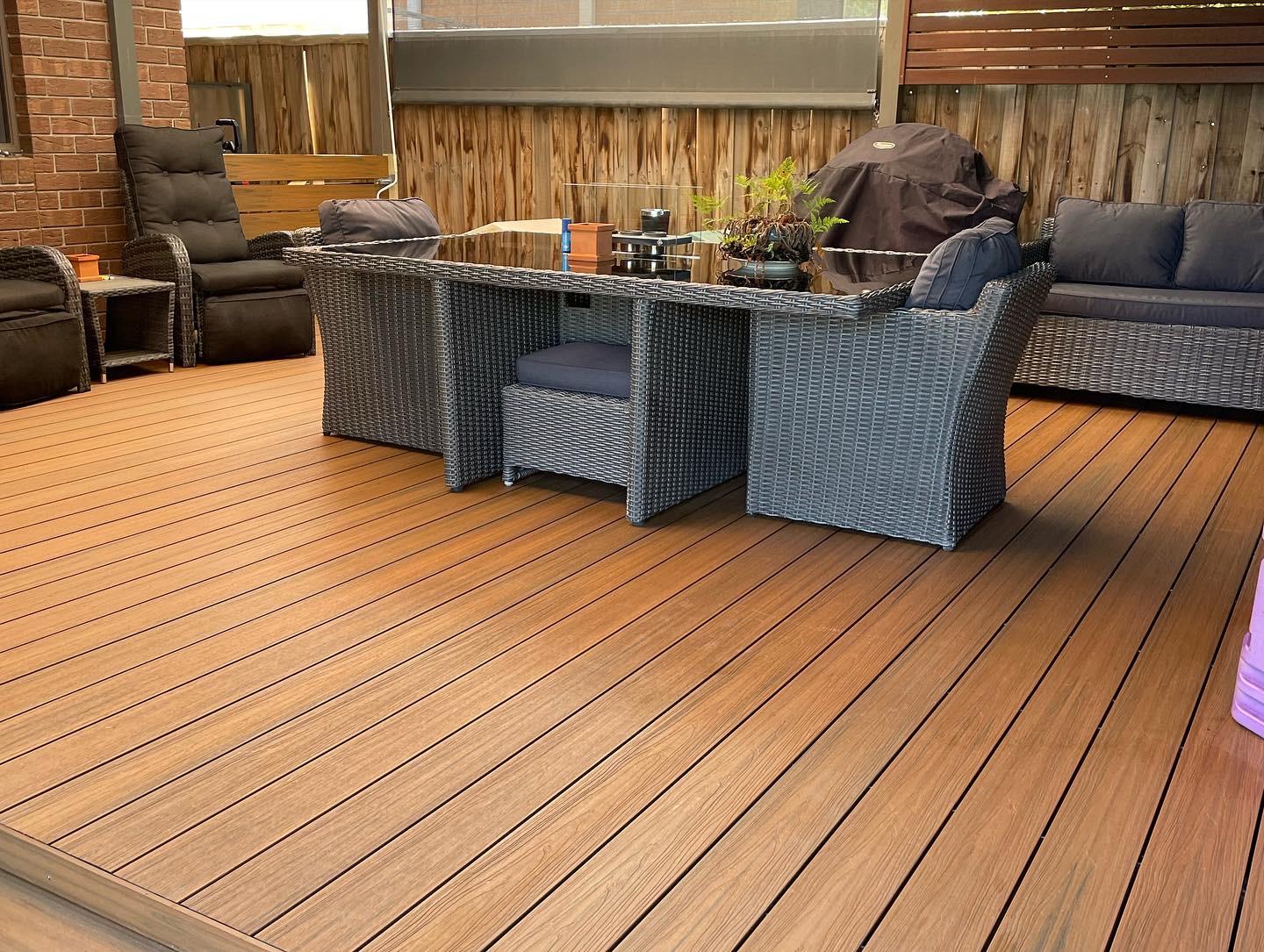 Custom timber deck with outdoor dining setting built by Vic Decking and Construction in Melbourne